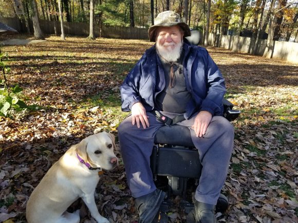 John with his companion dog